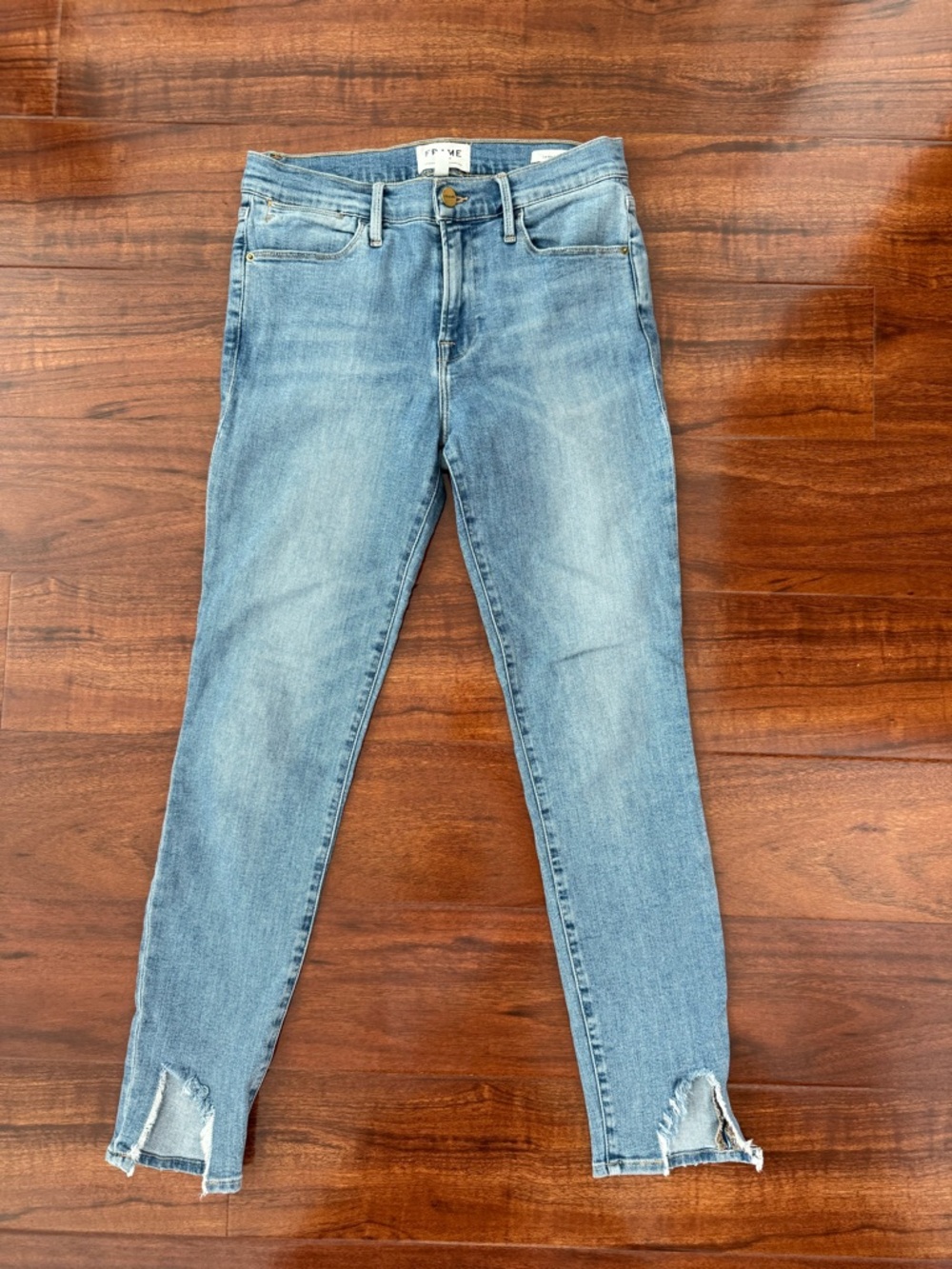 Frame Denim Light Blue Skinny Jeans with Raw Split Hem